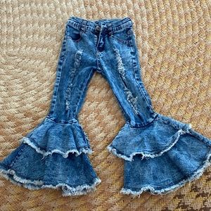Girls 4T bell bottom blue jeans.